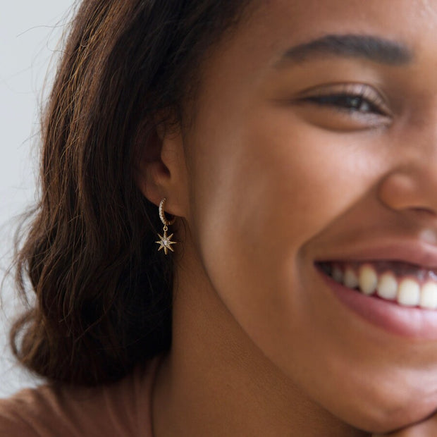 Crystal Star Huggie Hoop Earrings in Gold