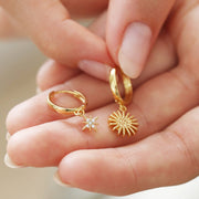 Sunburst and Star Charm Huggie Hoop Earrings in Gold